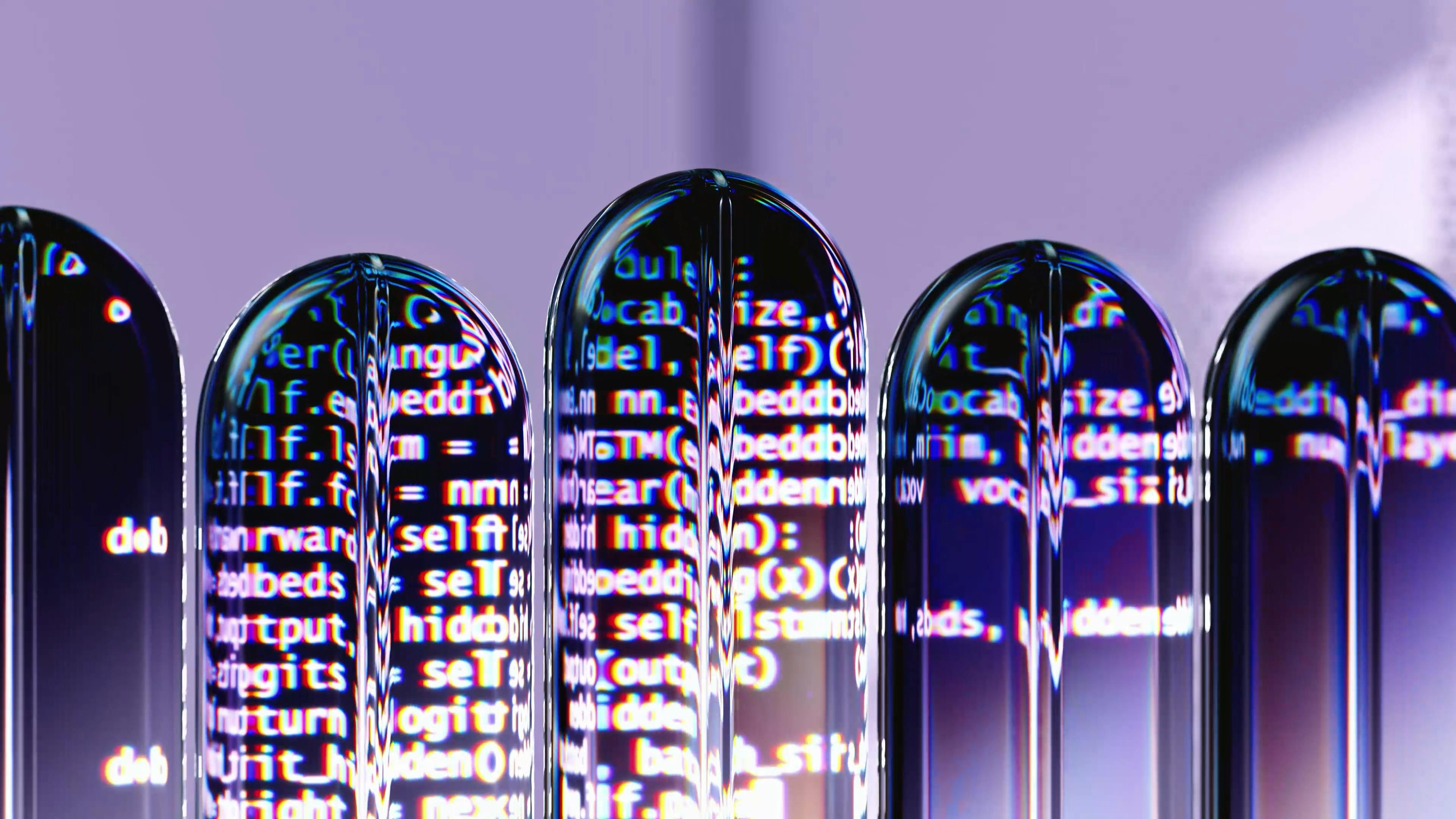 computer data projected onto various glass shapes